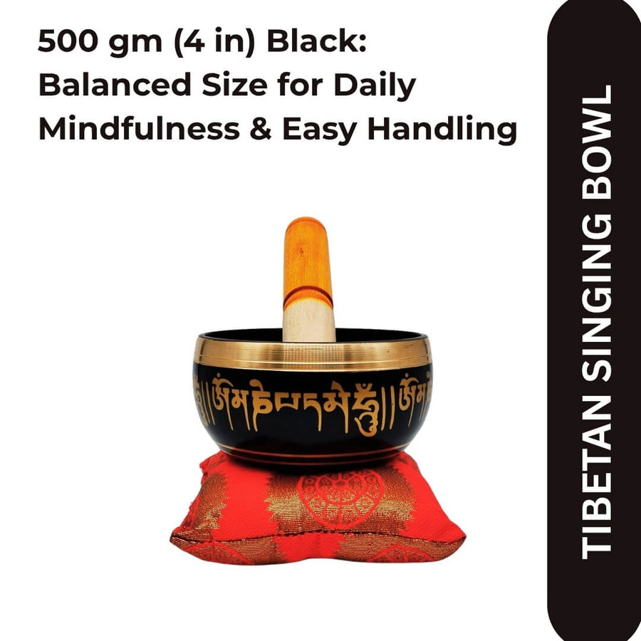 Tibetan singing bowl with red cushion and striker, front view