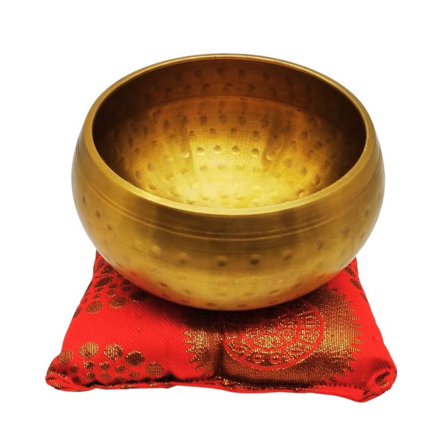 Singing Sound Bowl on red cushion, front view