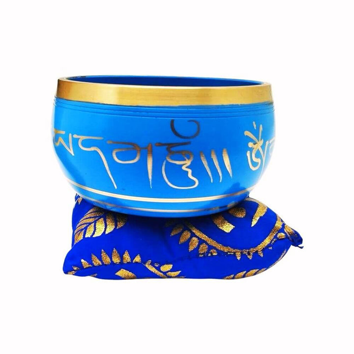 Tibetan Singing Bowl on blue cushion, front view